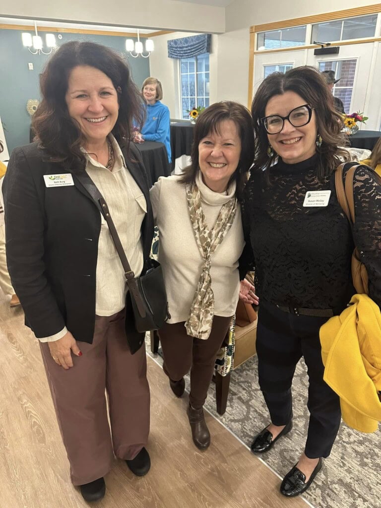 Three women party goers
